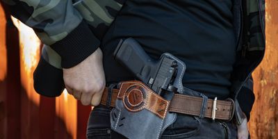 man with a handgun in a hip holster