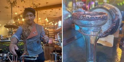 bartender creating cocktail, glass made of reused bottle and copper