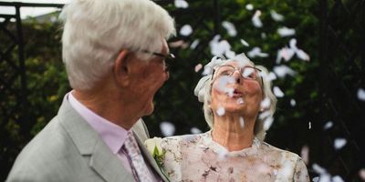 old couple dressed as if at a wedding