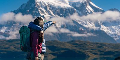 couple looking at a snow capped mountain