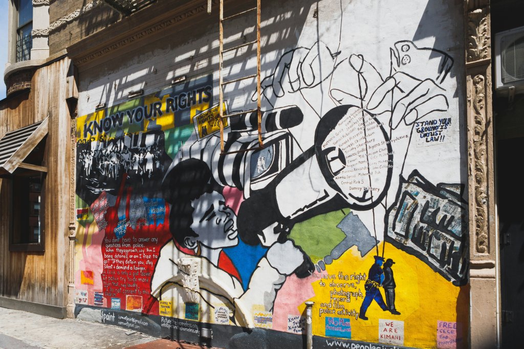 Colorful mural with "Know Your Rights" text and freedom-themed illustrations.