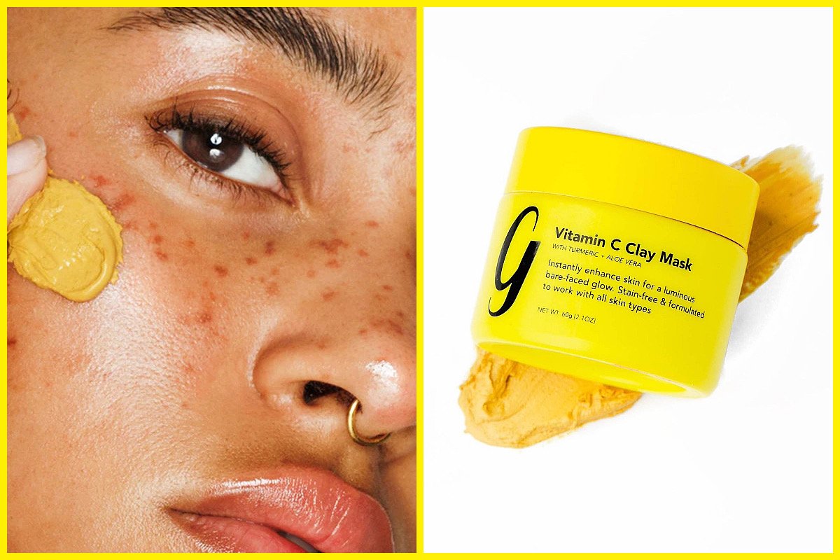 Close-up of a face applying yellow Vitamin C clay mask, product jar on the right.