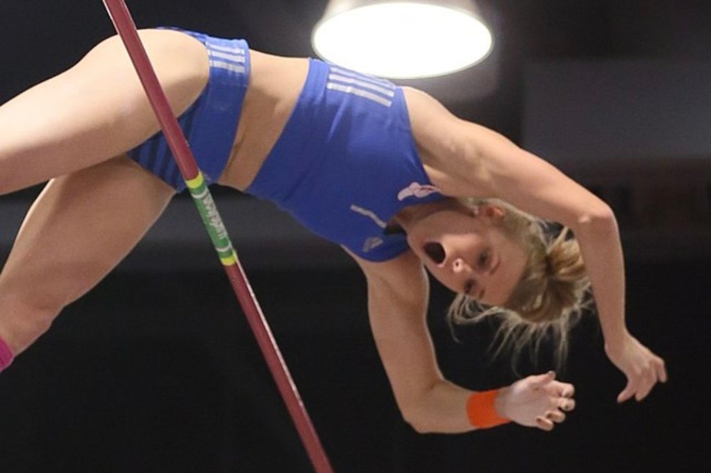 woman pole vaulting