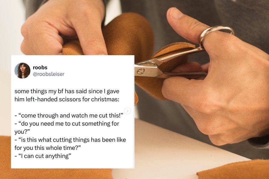 man cutting something with scissors in his left hand