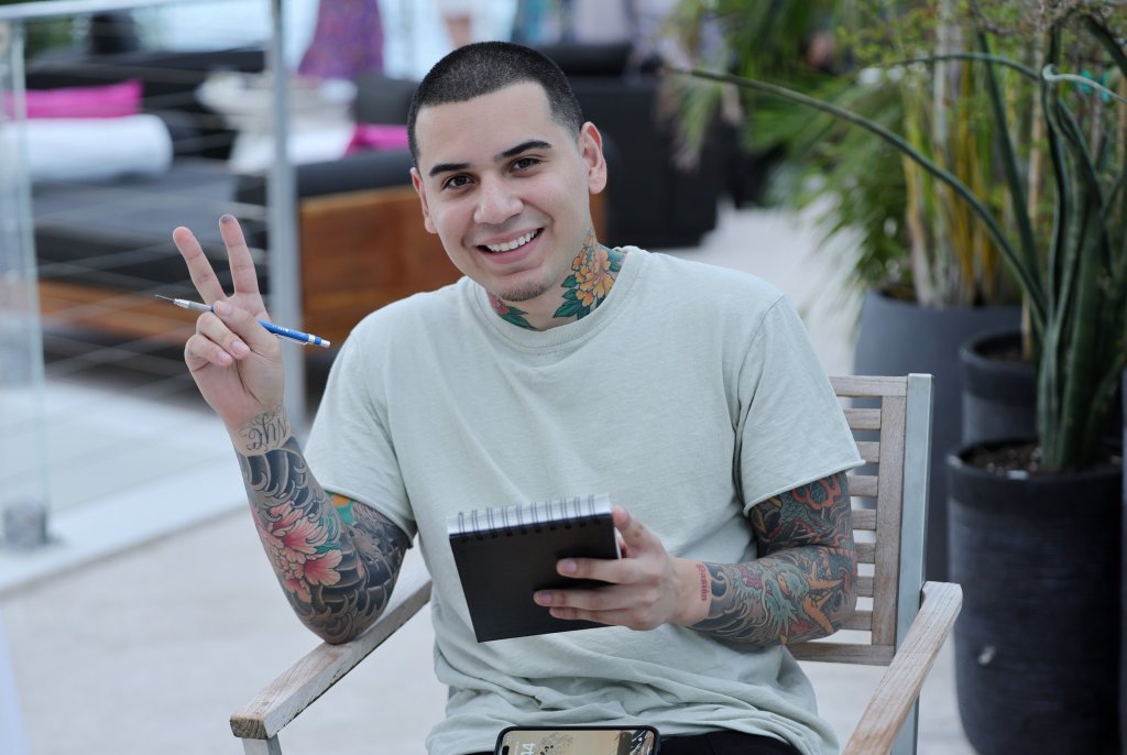 Devon Rodriguez holding a sketchpad