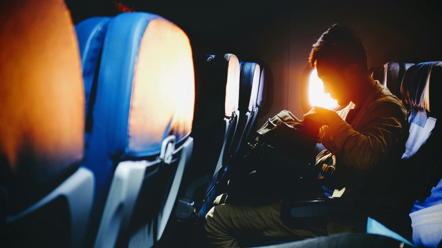 man sitting on an airplane