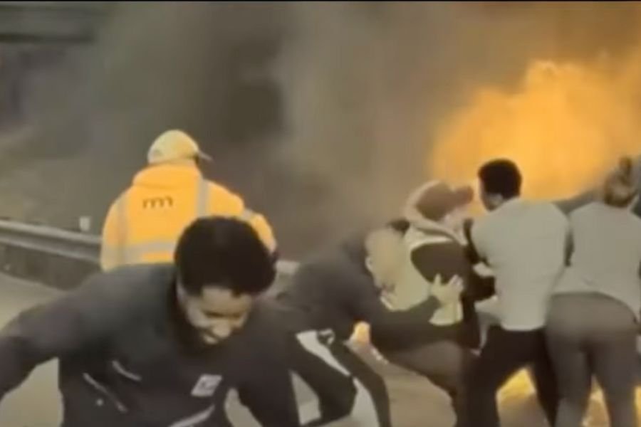 Minnesota driver rescued; driver in burning car; people save driver; burning car; burning car rescue