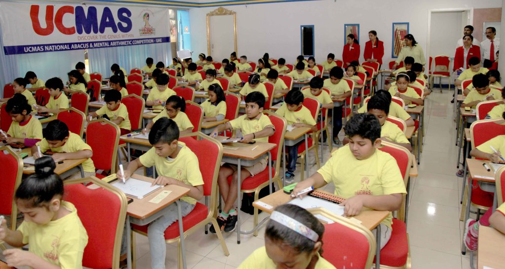 kids in desks at a math competition