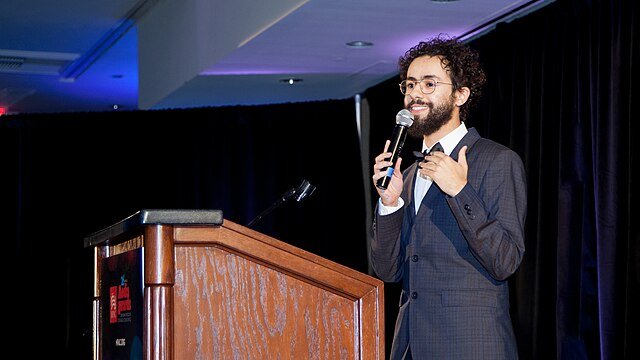 Ramy Youssef at a podium