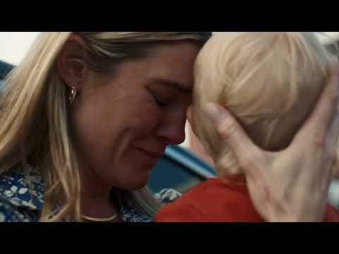 upset mom cradling her child