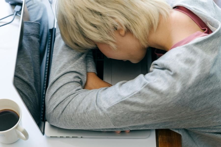 someone asleep on their laptop