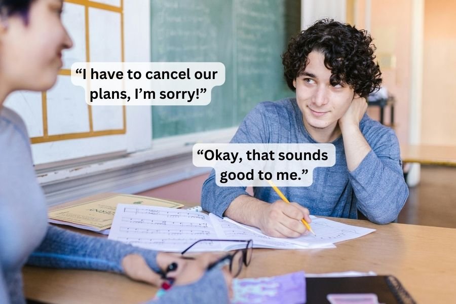 two people looking at each other over a desk