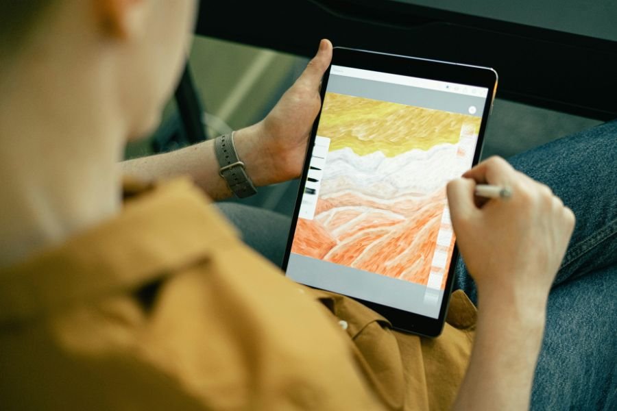 person creating art on a digital tablet