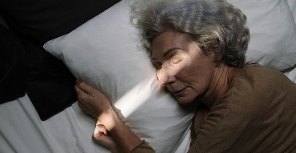 unconscious woman in a bed