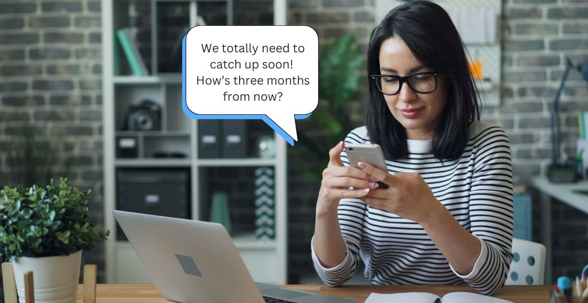 woman texting at a desk