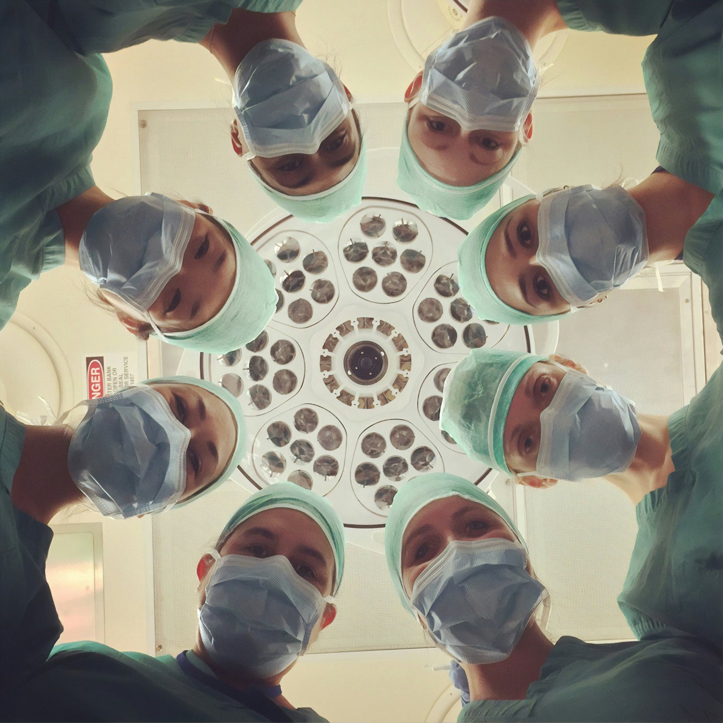 a team of doctors looking at the camera