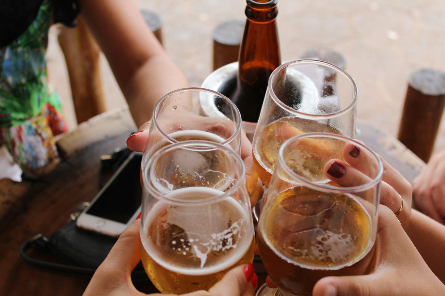 A group of people cheers-ing with glasses