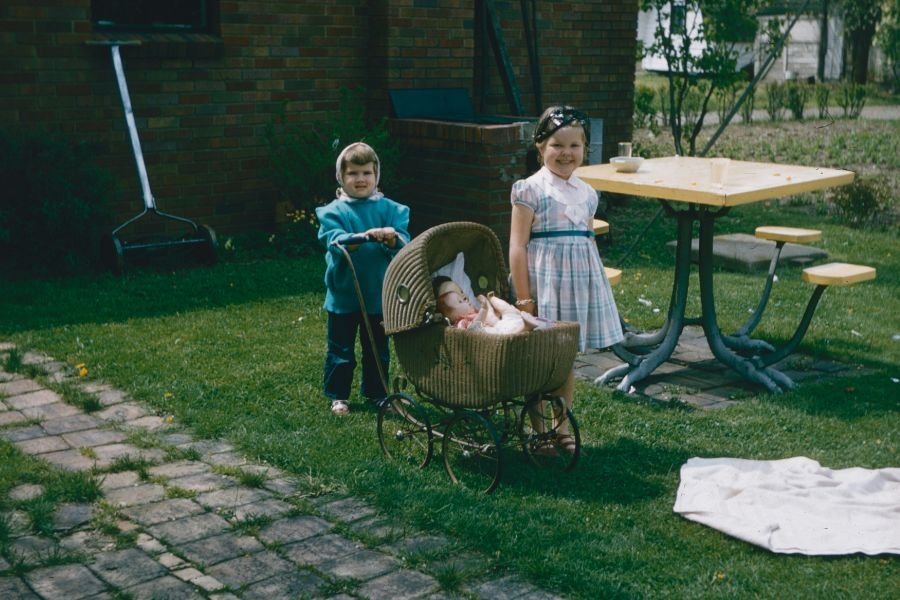 two little kids and a baby in the 1950s