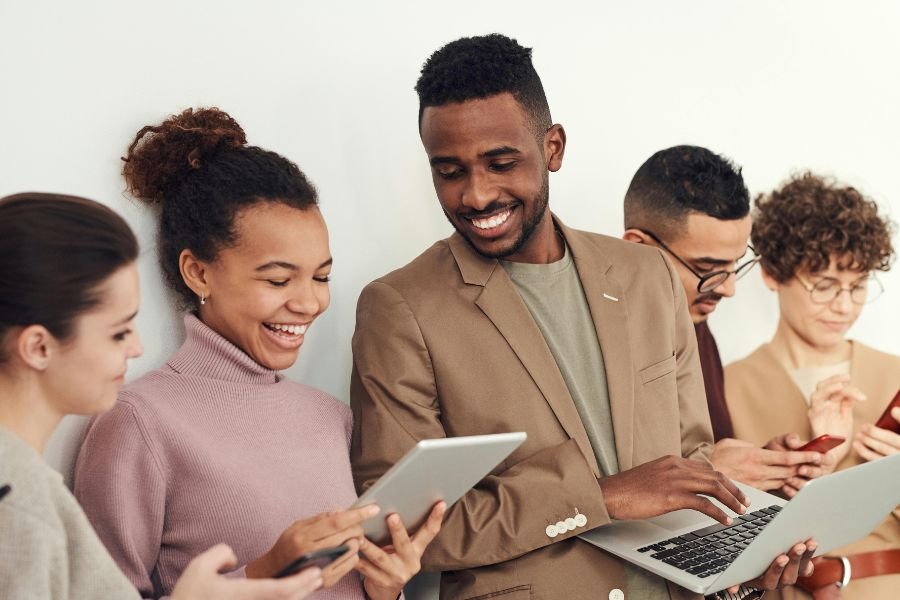 people of different races conversing at work