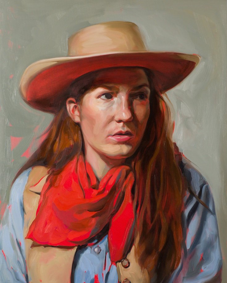 Woman in cowboy gear with red bandana