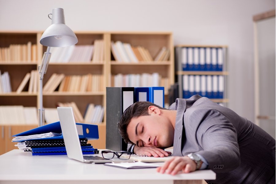 man asleep at his desk