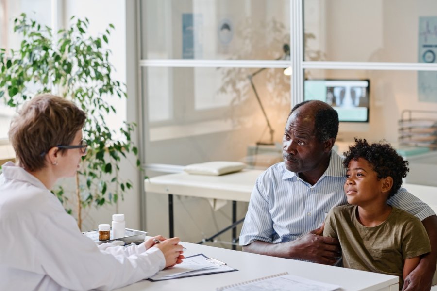 dad with child at doctor