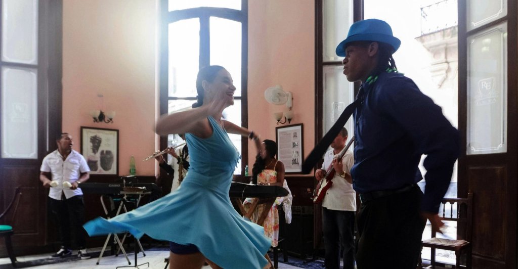 A couple salsa dancing in a club