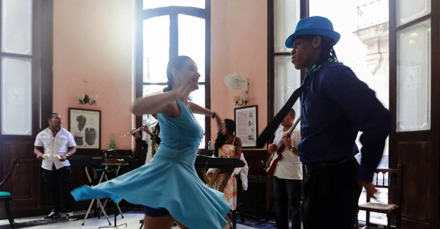 A couple salsa dancing in a club