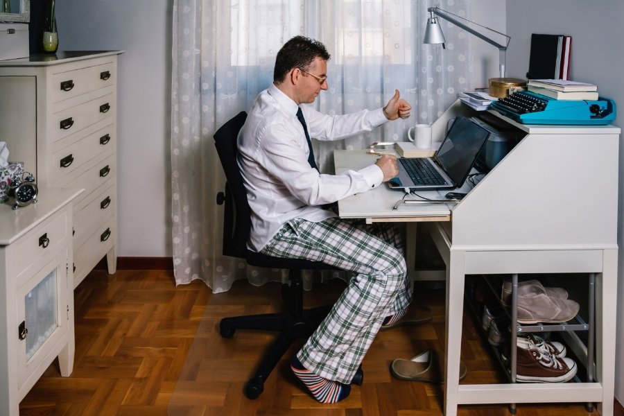 man in shirt and tie with pajama pants