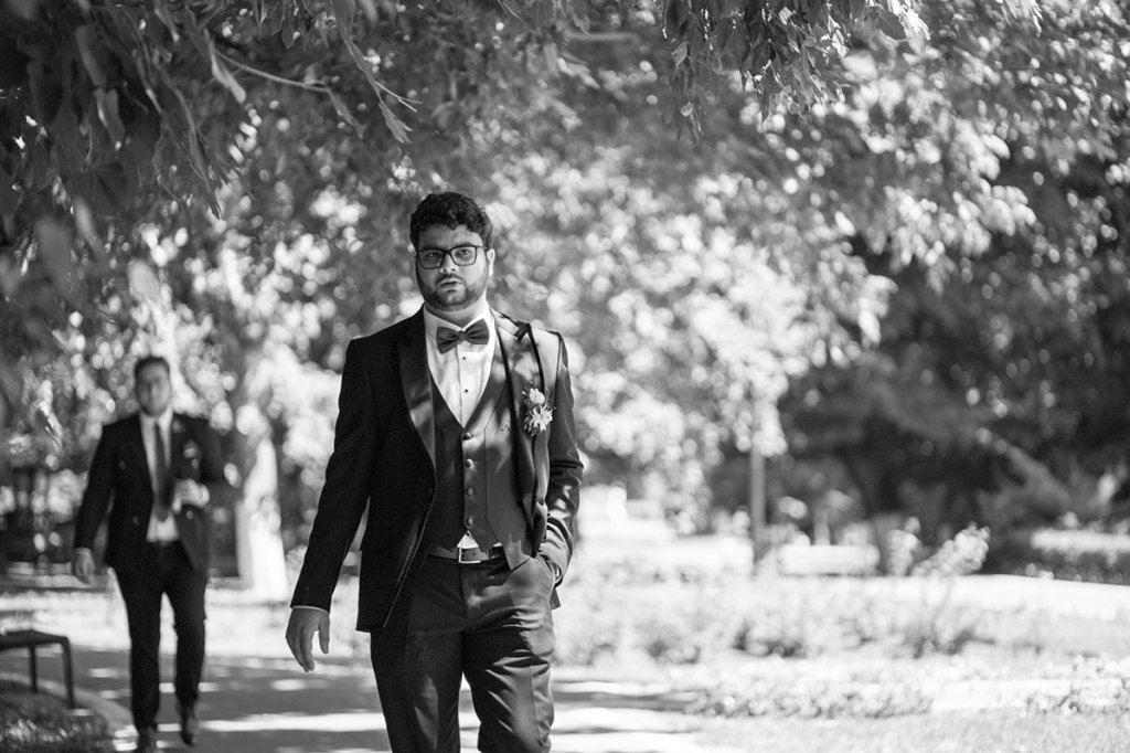 Two men looking bothered at a wedding.