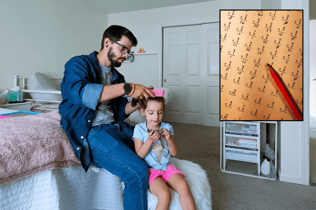 man brushing daughter's hair