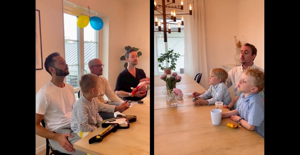 dads singing with kids around a dining table