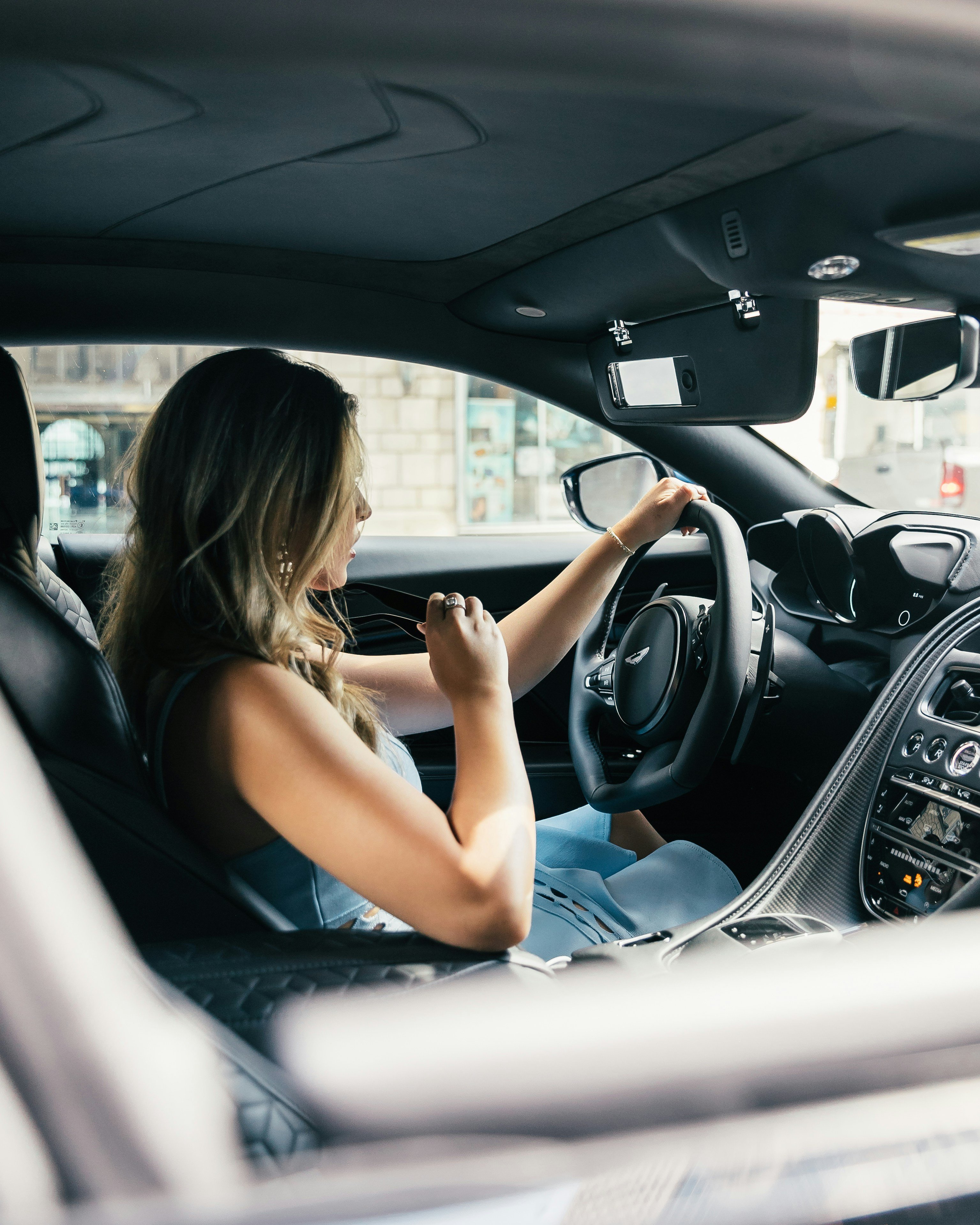 Woman sitting alone in car