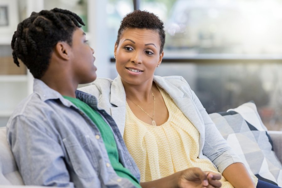 woman talking with a teen