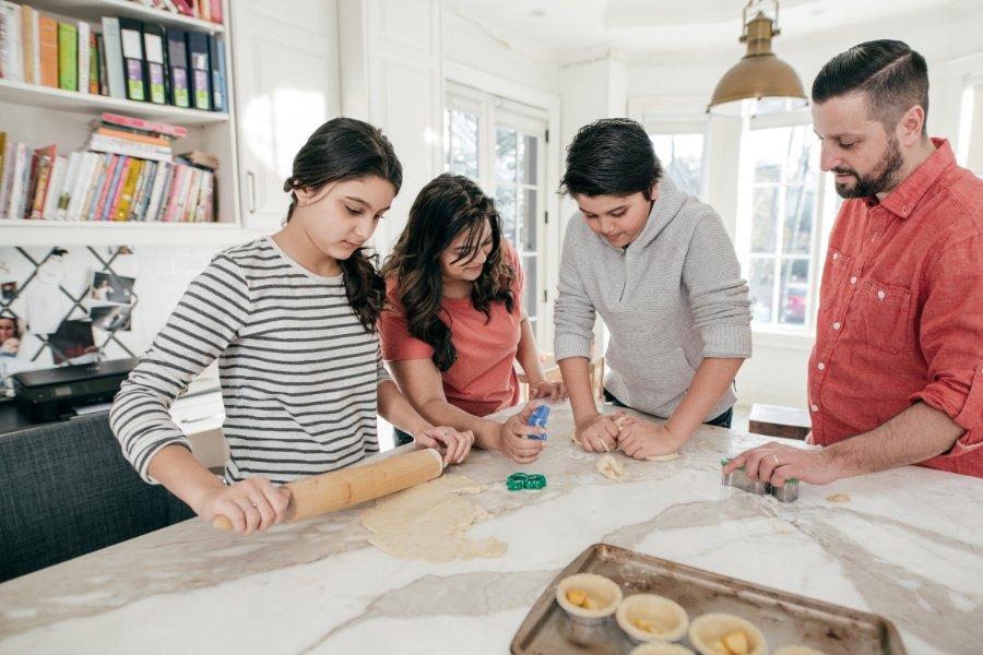 teens helping bake in the kitchen