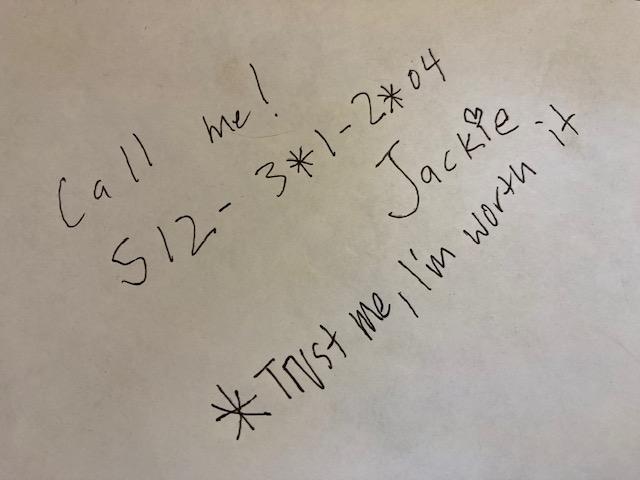 a handwritten note of a woman's number that says, 'Call me!'