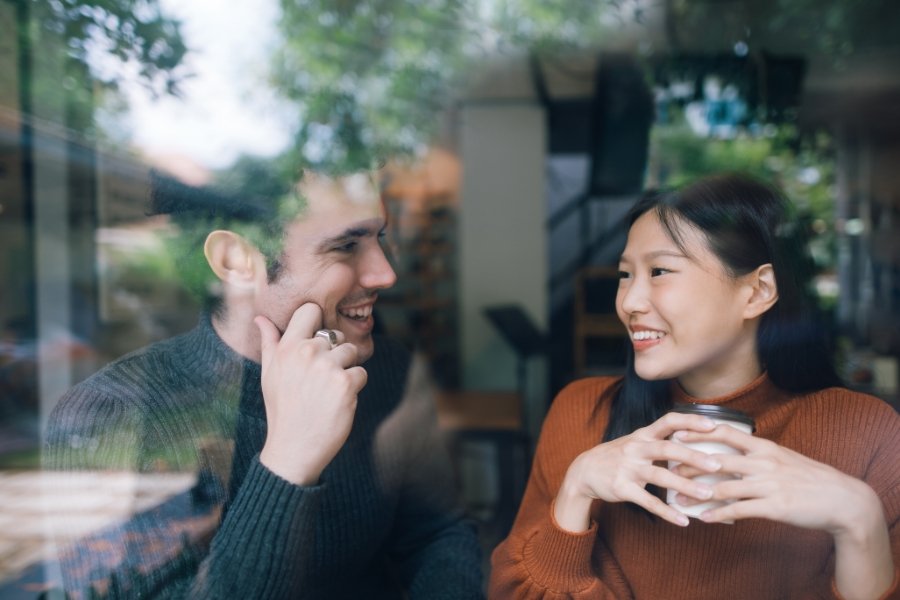 man and woman talking over coffee