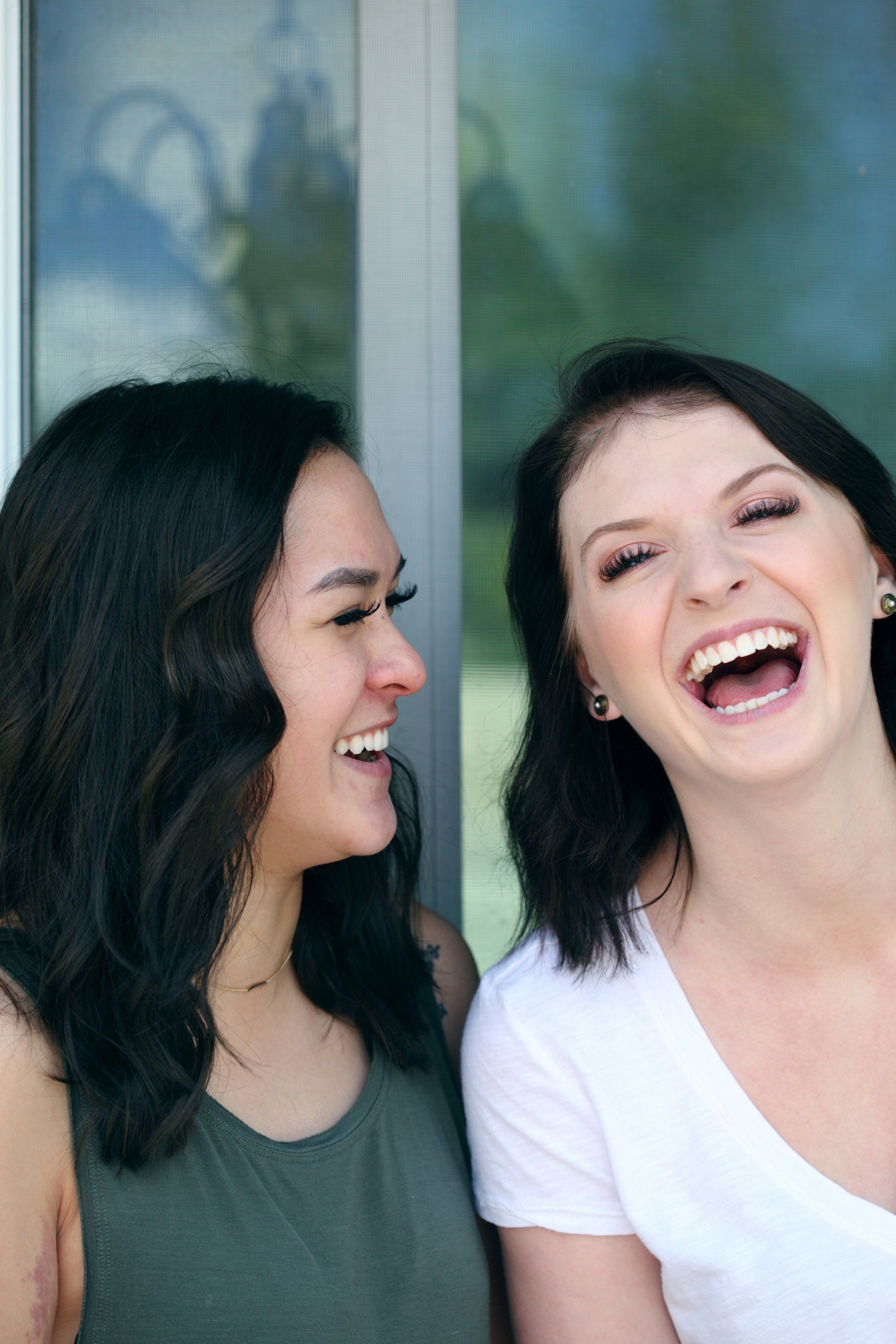 two women laughing and smiling