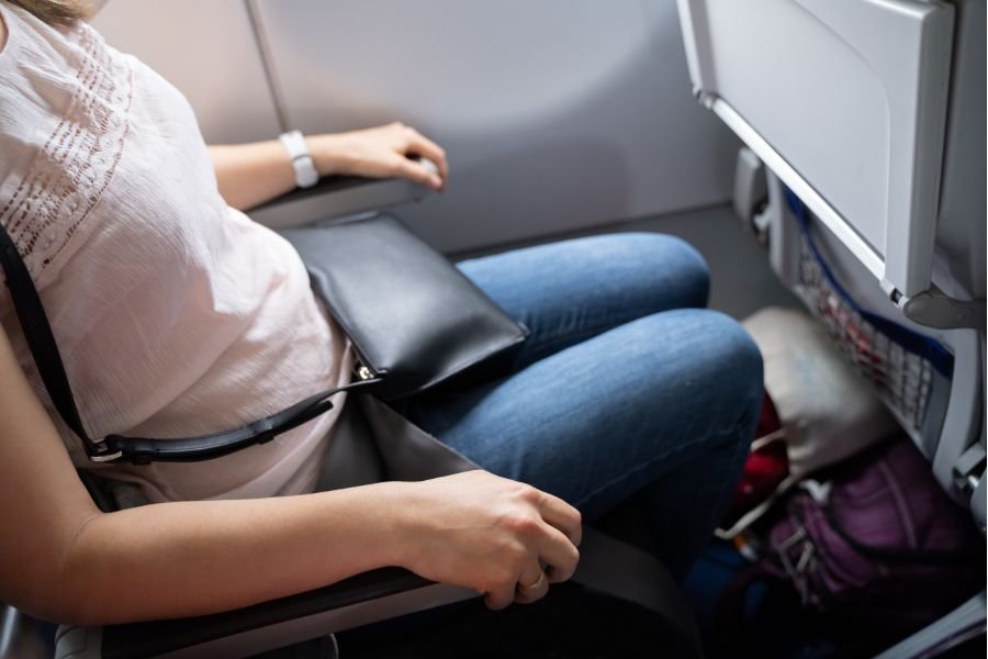 woman sitting in an airplane seat