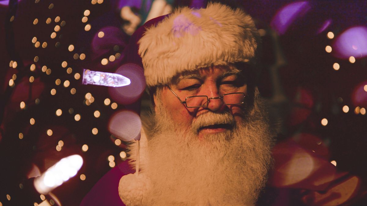 santa claus sitting with white lights