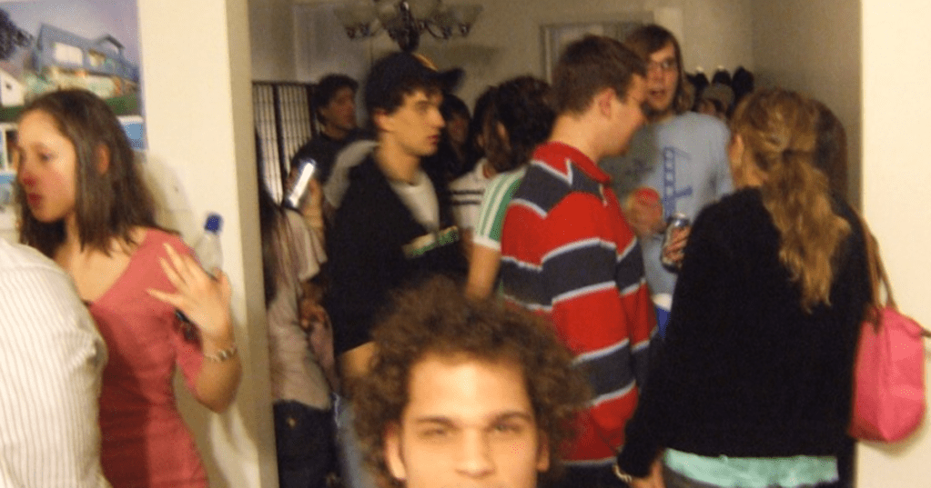 a blurred photo of people at a house party