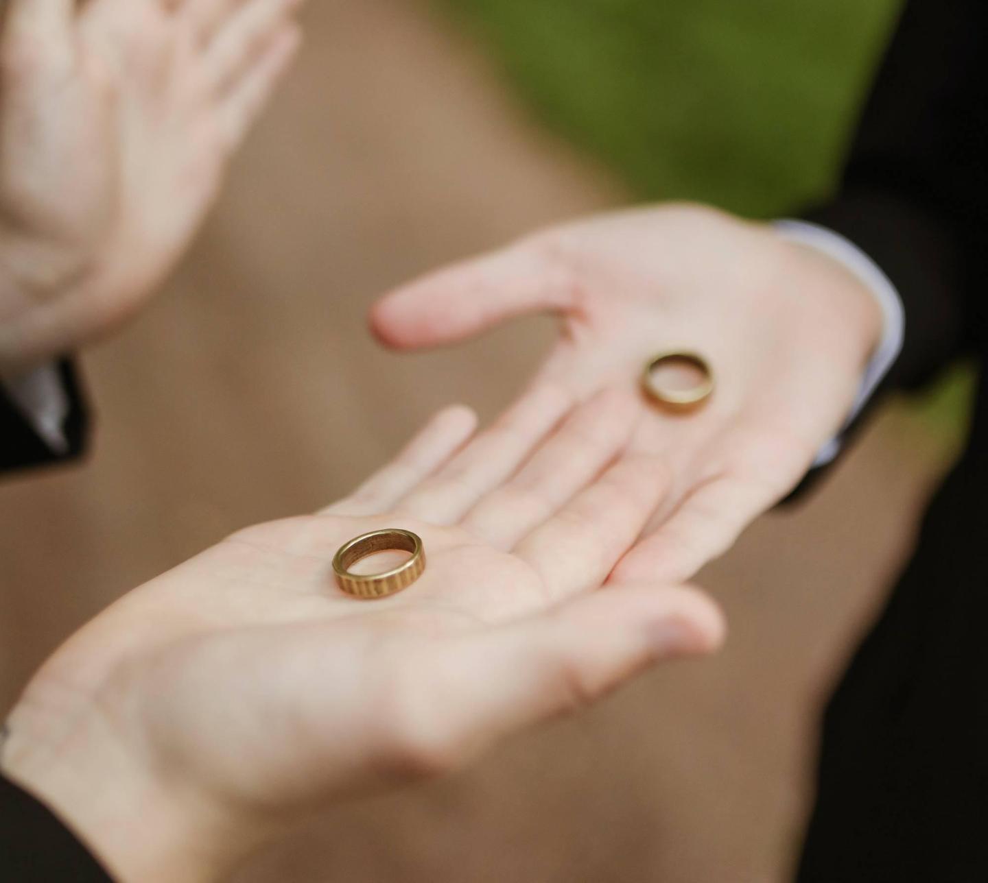 Two men exchanging rings in a wedding ceremony.