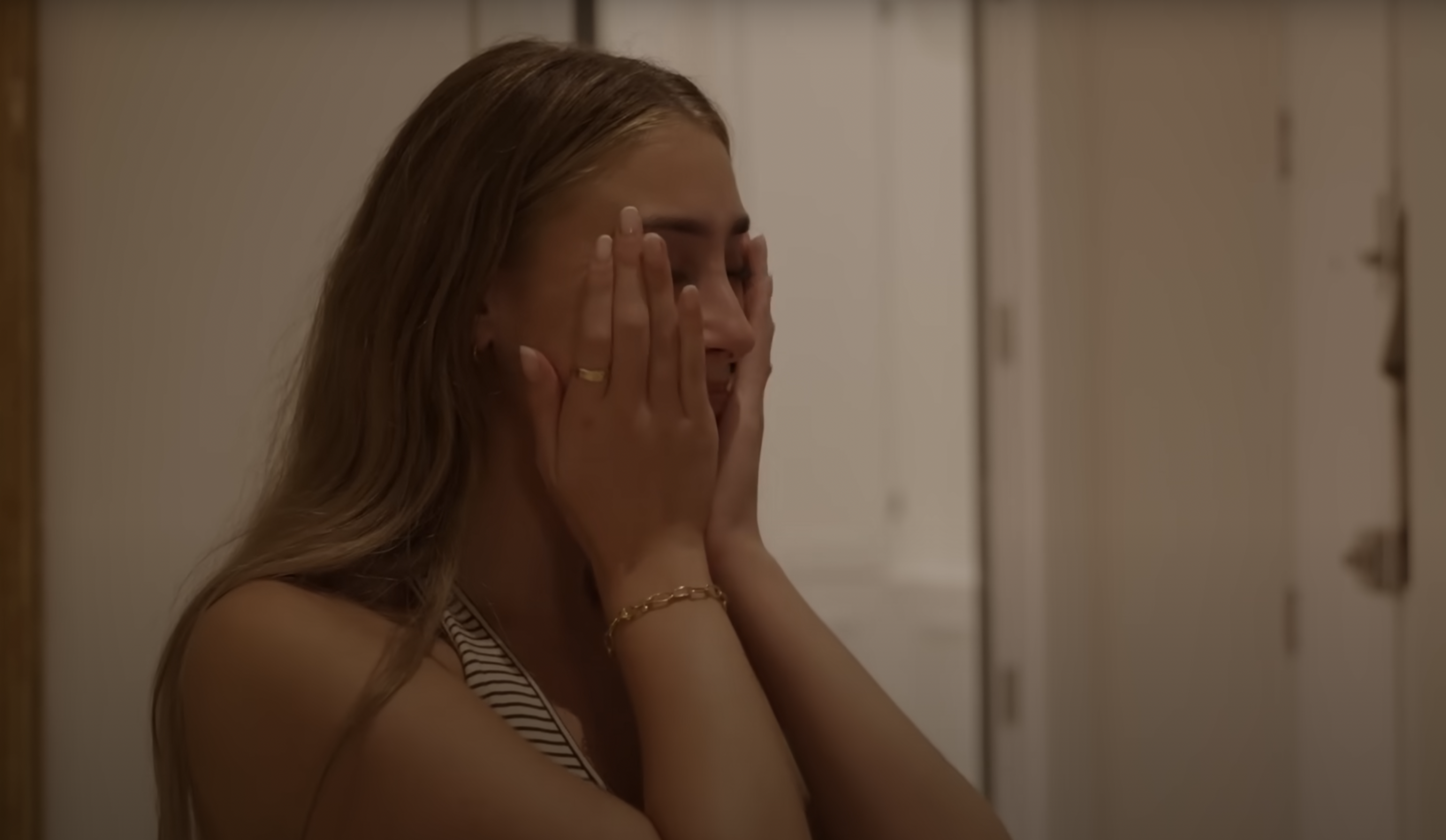 Lily Phillips crying and collecting herself while being interviewed by documentary crew