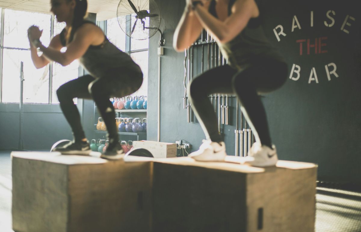 Women in black athletic wear exercising