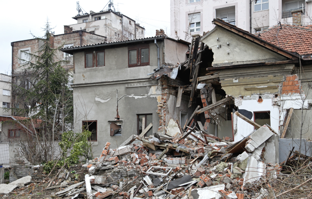 A torn down house and rubble from an earthquake
