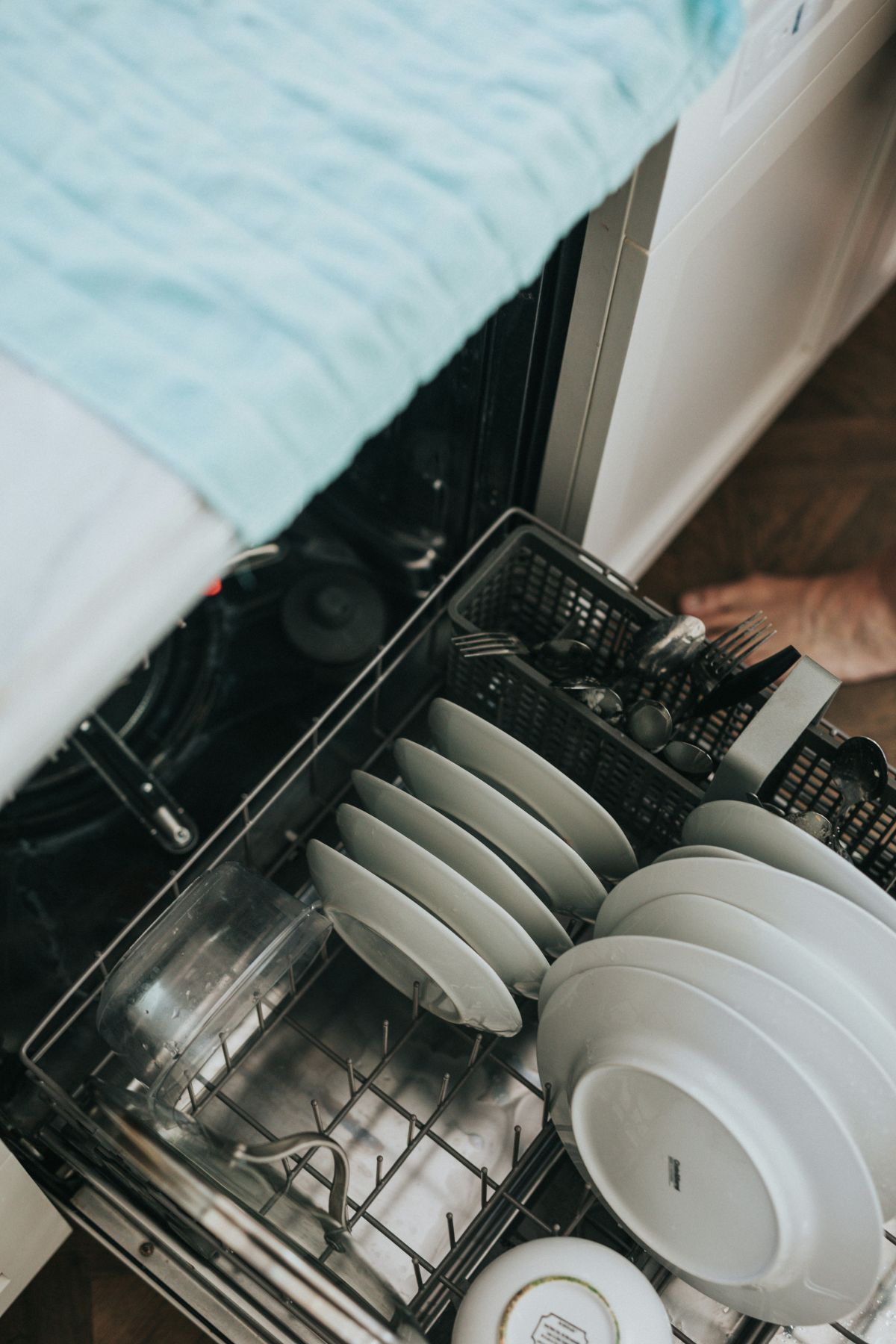 A half loaded dishwasher