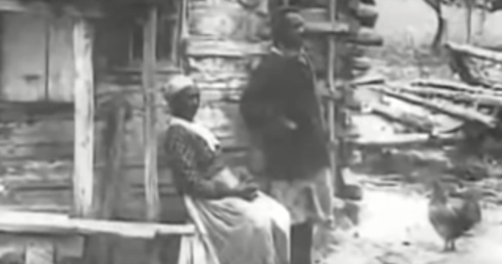 Black and white photo of two enslaved people on a plantation