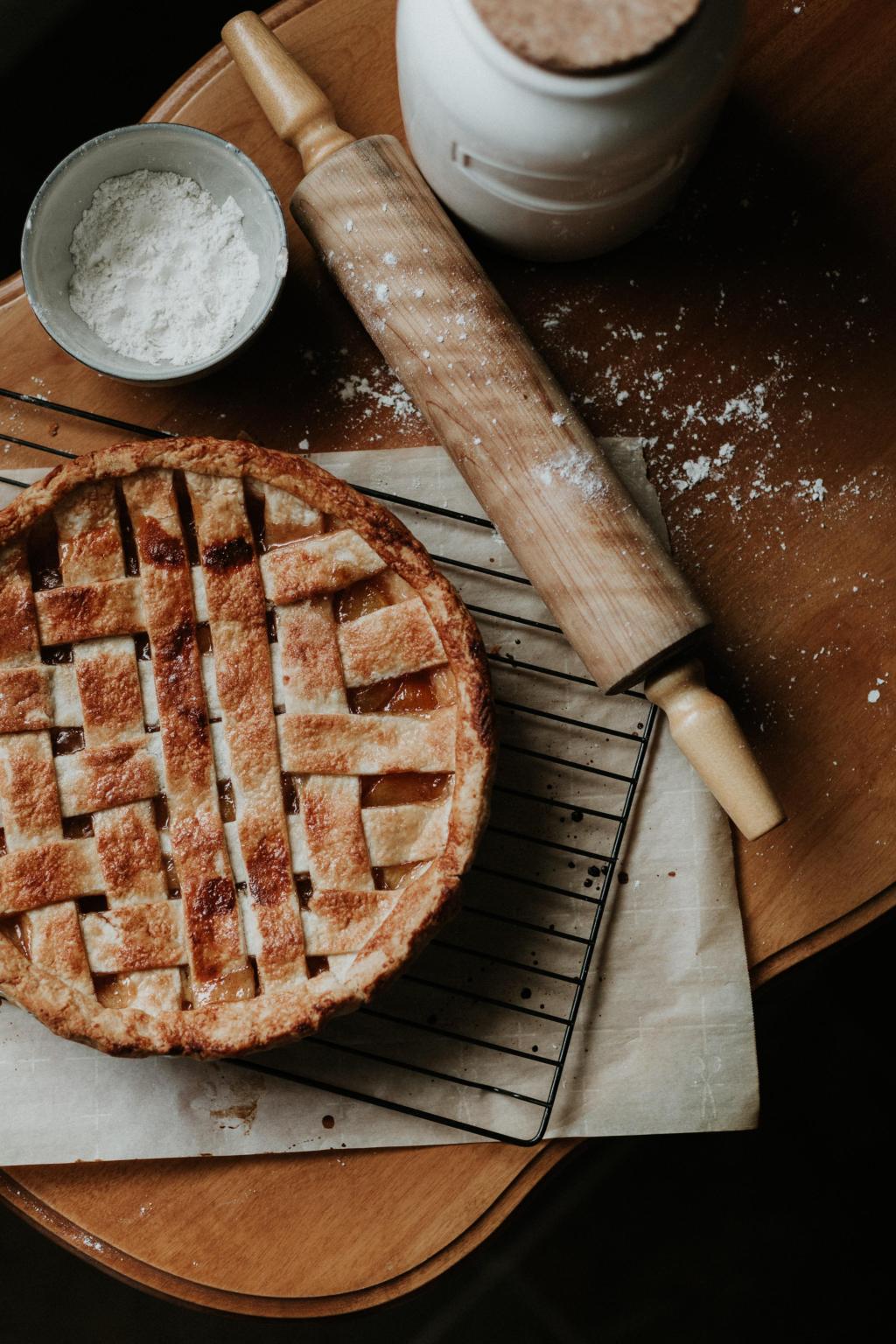 pie and baking roller on counter with flour
