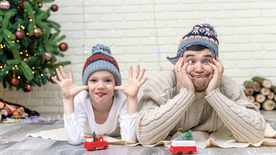 A girl and her dad making silly faces