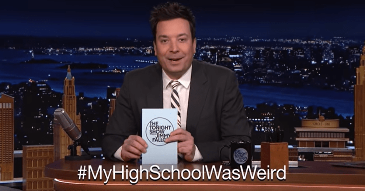 Jimmy Fallon on The Tonight Show smiling behind hashtag text